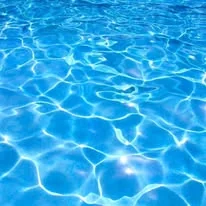 Sunlight on blue pool water